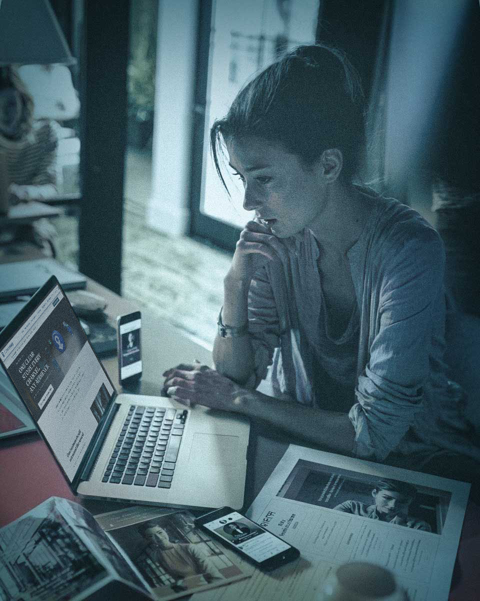 Reviewing a business across website, phone profile and printed pitch materials